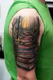 Book path through forest tattoo, half sleeve, greens, browns, ochre.