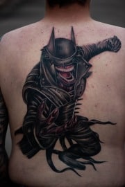 The batman who laughs back piece tattoo, art in motion tattoos.