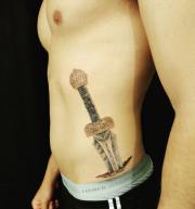 Sword-with-latin-on-hip-with-skin-rip