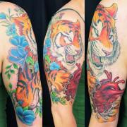 Tiger-holding-anatomical-heart-with-flowers-half-sleeve