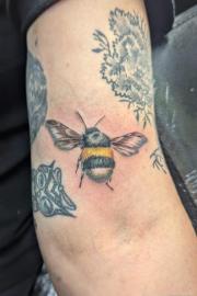 Fluffy bumblebee tattoo