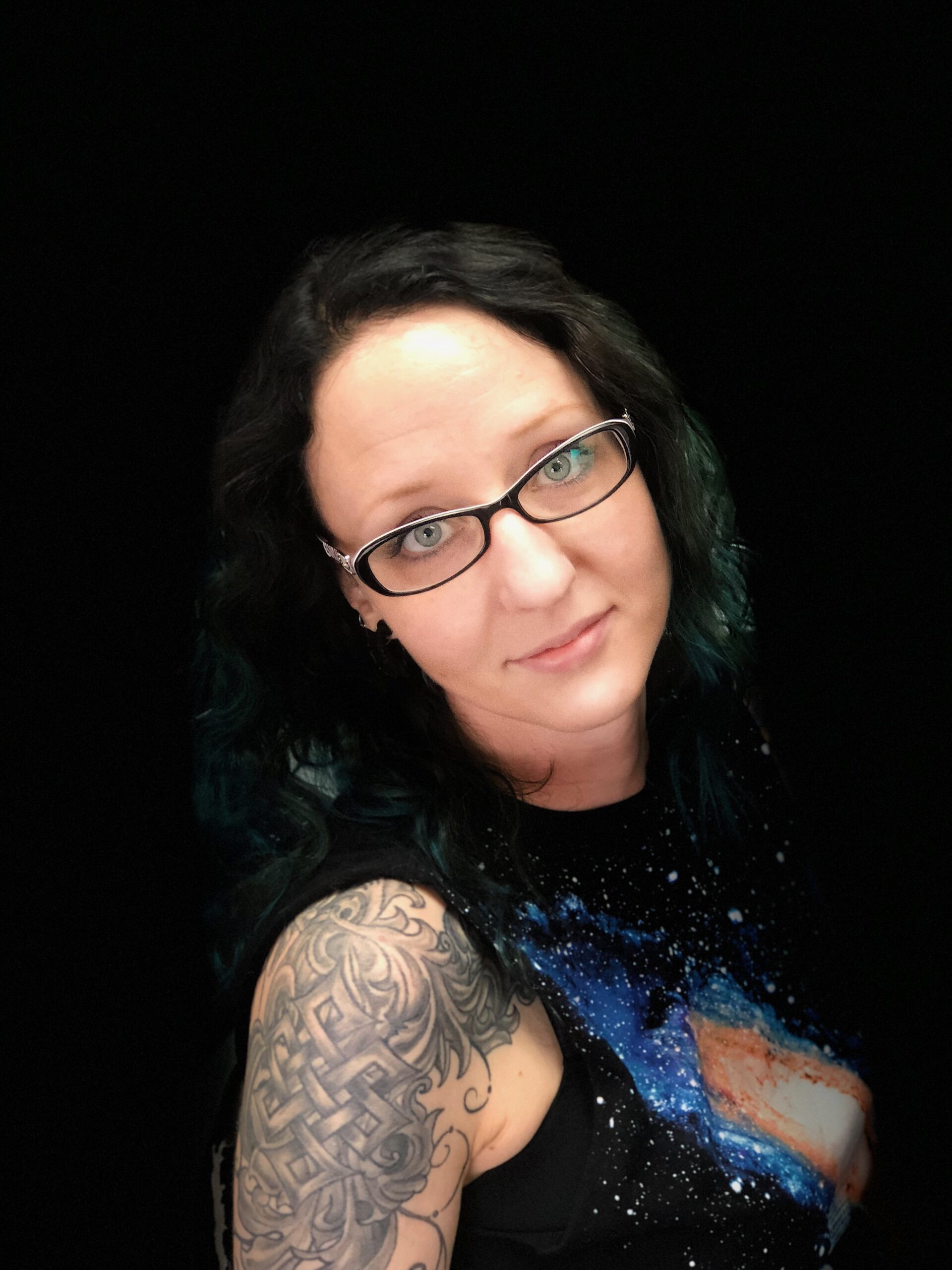 headshot of tattoo artist shelly at art in motion tattoos in colorado springs, co