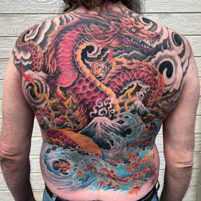 Japanese style color back piece by Mark at Art In Motion Tattoos.  #artinmotiontattoostudio #artinmotiontattoosandpiercing #coloradospringstattooartist #japanesetattoo #dragontattoo #japanesestyle #colortattoo #tattoo #tattooed #ink #inked #eternalink